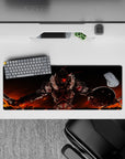 Anime desk pad 32x12 inches in fiery red and orange tones with an intense last-stand battle mood.