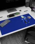 40x20 inches anime desk pad showing a blue-haired katana swordsman in cobalt coat and gold scarf.