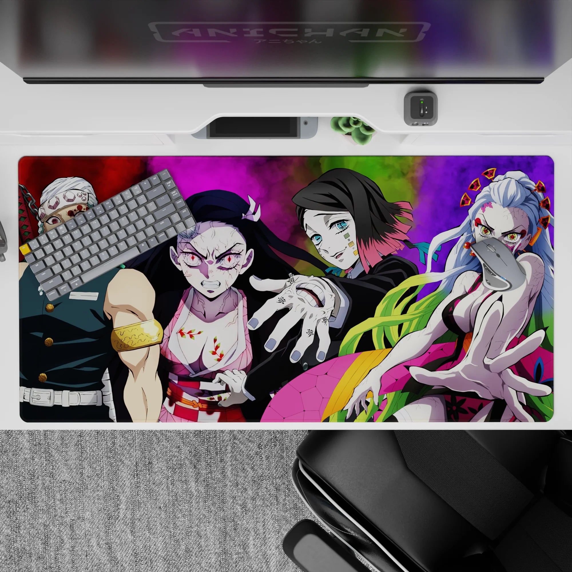 Desk pad 40x20 inches featuring Tengen Uzui, Nezuko, Gyutaro, and Daki in vibrant Demon Slayer anime showdown.