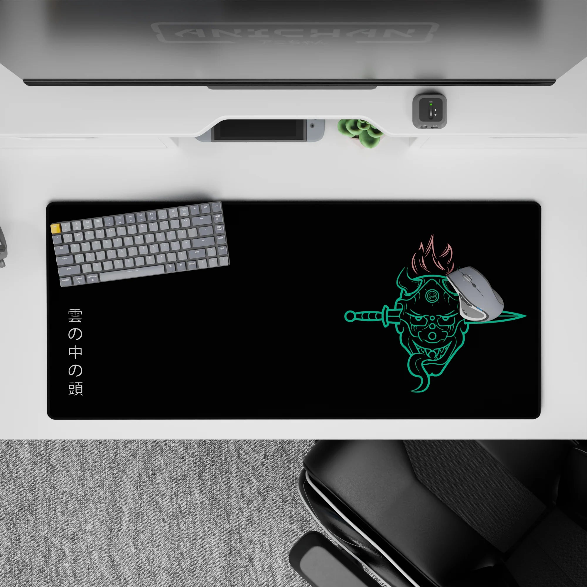 Anime desk pad 36x16 inches featuring a neon oni mask with twin blades, fiery hair, and Japanese kanji on a black backdrop.