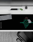 Anime desk pad 36x16 inches featuring a neon oni mask with twin blades, fiery hair, and Japanese kanji on a black backdrop.