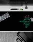 Anime desk pad 40x20 inches featuring a neon oni mask with twin blades, fiery hair, and Japanese kanji on a black backdrop.