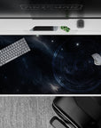 Moody navy and cool blue-gray desk pad 40x20 inches with a quiet, cinematic night-sky feel.