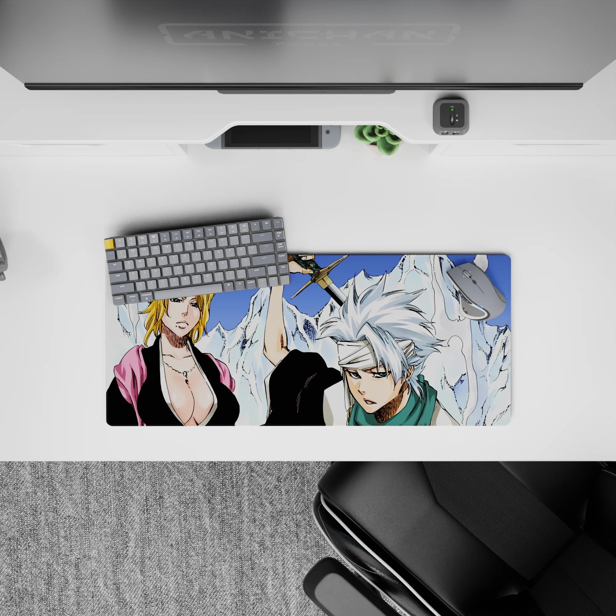 Anime mouse pad 28x12 inches featuring Bleach captains Rangiku and Tōshirō amid ice mountains, with stark whites and blues.