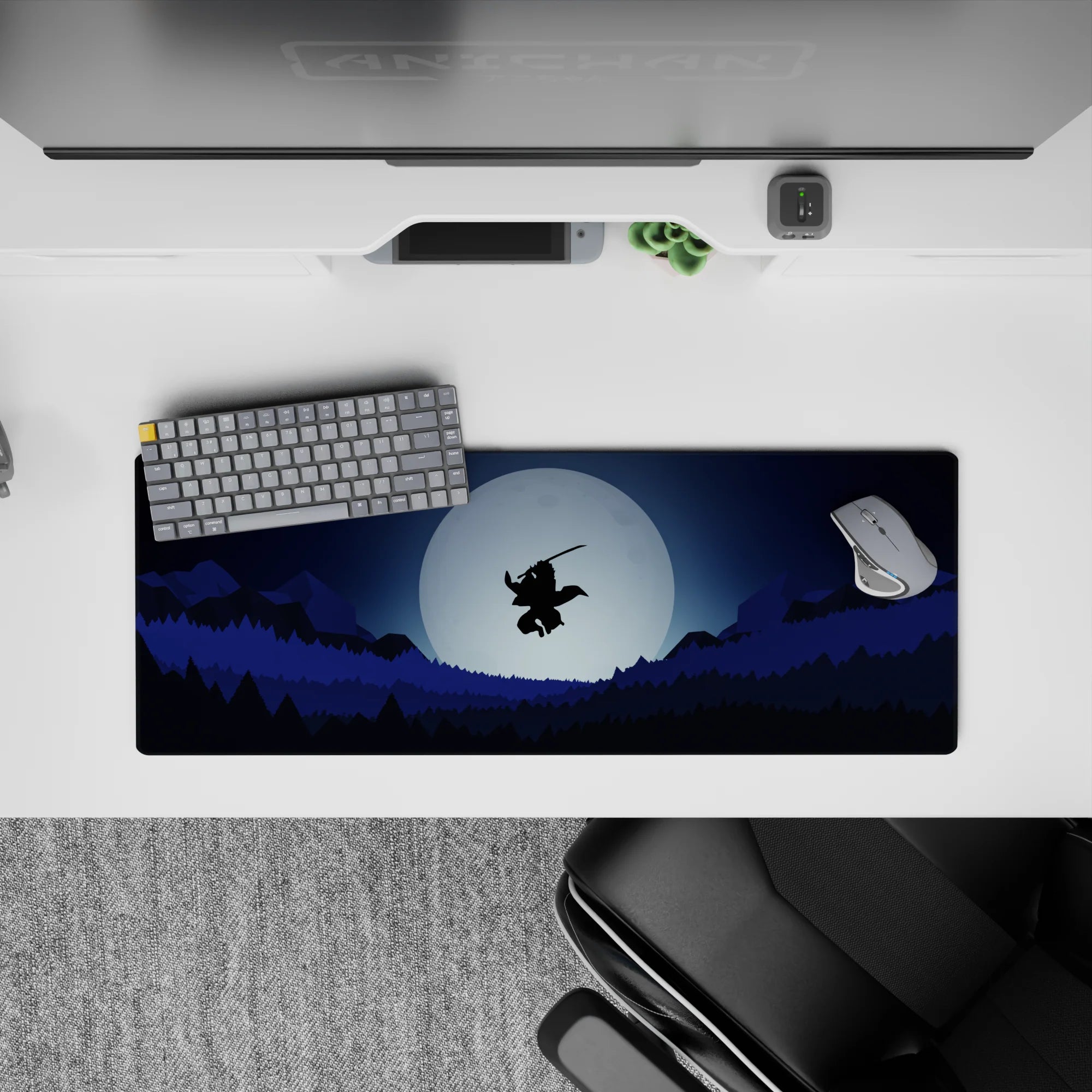 Anime mouse pad 32x12 inches featuring a lone samurai mid-air against a full moon, with layered forests and mountains.