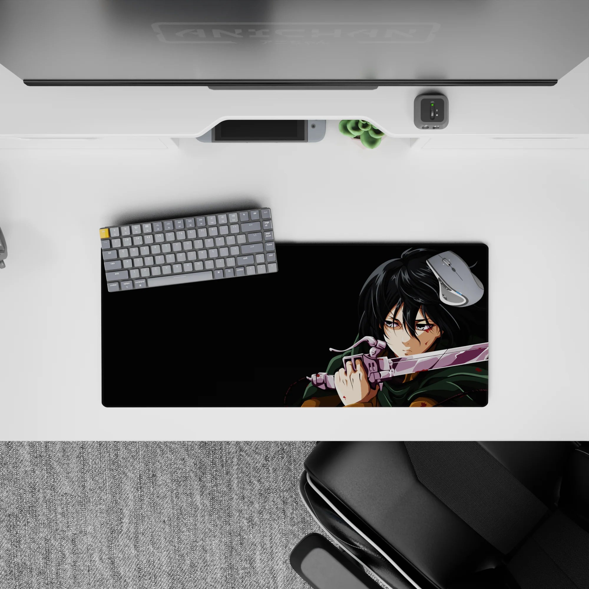 Mikasa Ackerman from Attack on Titan mouse pad, 28x12 inches, mid-battle scene with a forest green cloak and intense gaze.