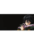 Anime desk pad 36x16 inches featuring Mikasa Ackerman from Attack on Titan mid-battle, vivid colors and dynamic design.