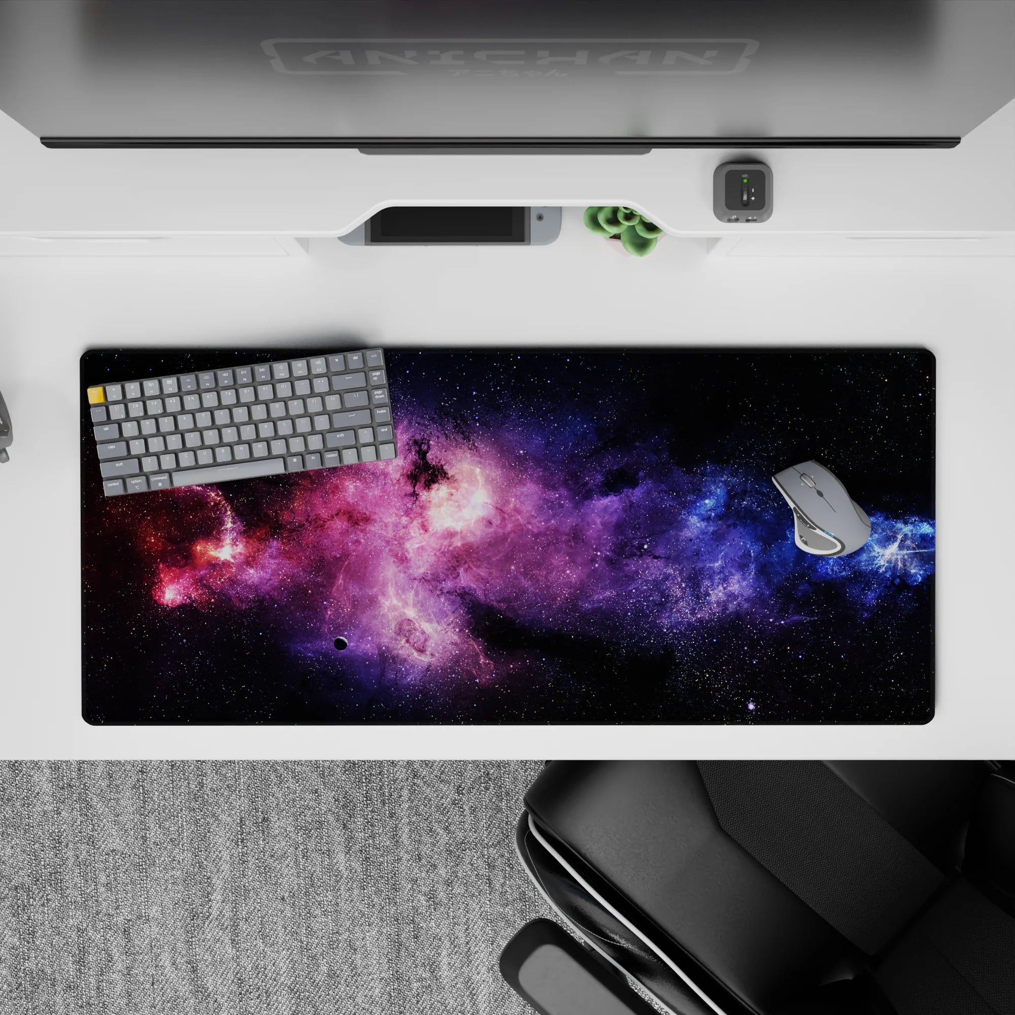 Purple haze and electric blue on midnight black desk pad 36x16 inches, calming dreamy space mood.