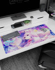 36x16 inches Touhou Patchouli Knowledge desk pad holding a moon staff over an open grimoire.