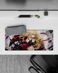 Anime girl mouse pad 28x12 inches in crimson and black with magenta ribbons on a smoky gray backdrop.