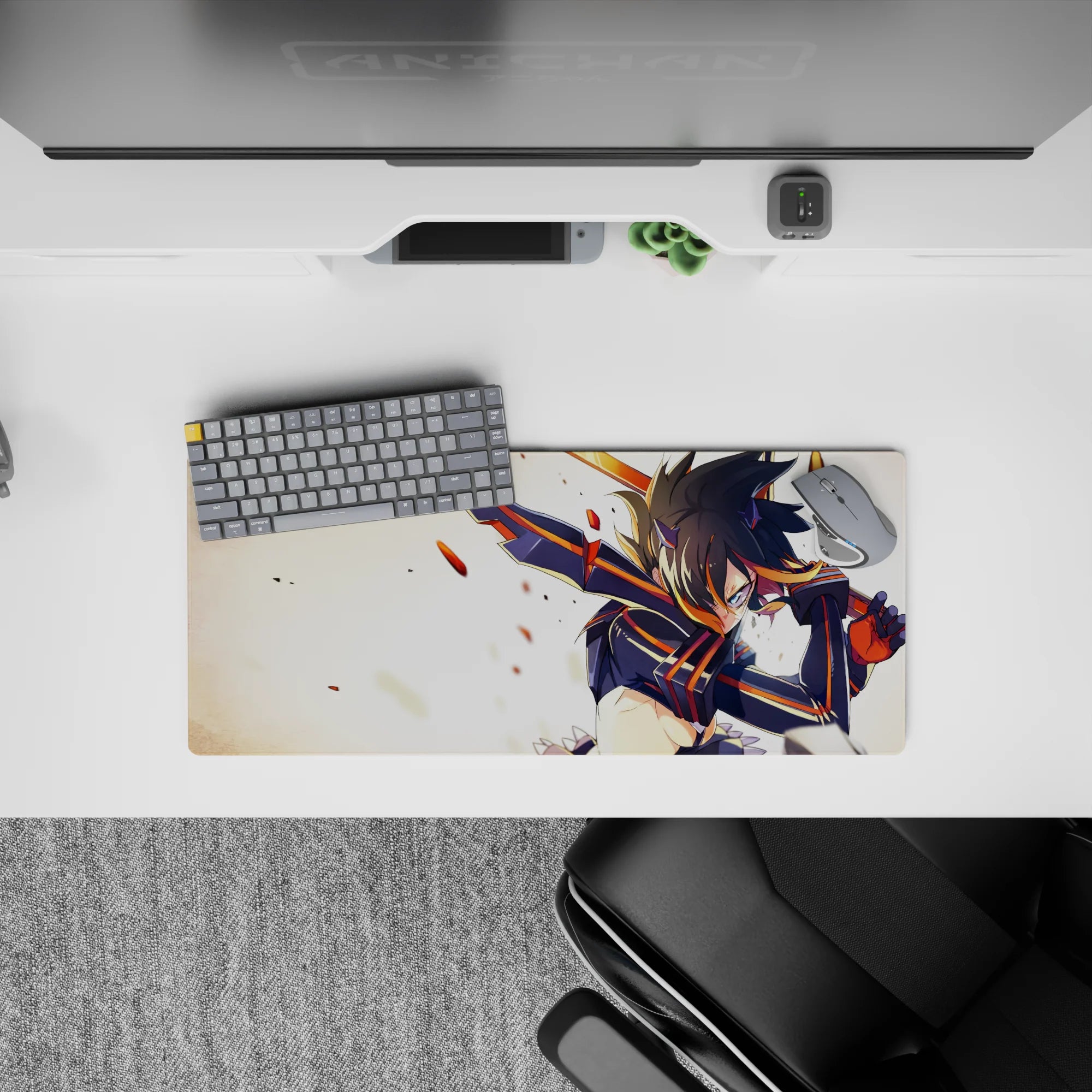 Anime girl mouse pad 28x12 inches in bold black-and-orange with glowing eyes, sparks, and chaotic energy.