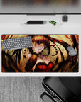 32x16 inches anime desk mat in warm gold and deep shadows with a punchy red corset, daring vibe.