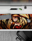 Anime girl desk pad 36x16 inches in warm gold clockwork tones, deep shadows, and candy-red accents.