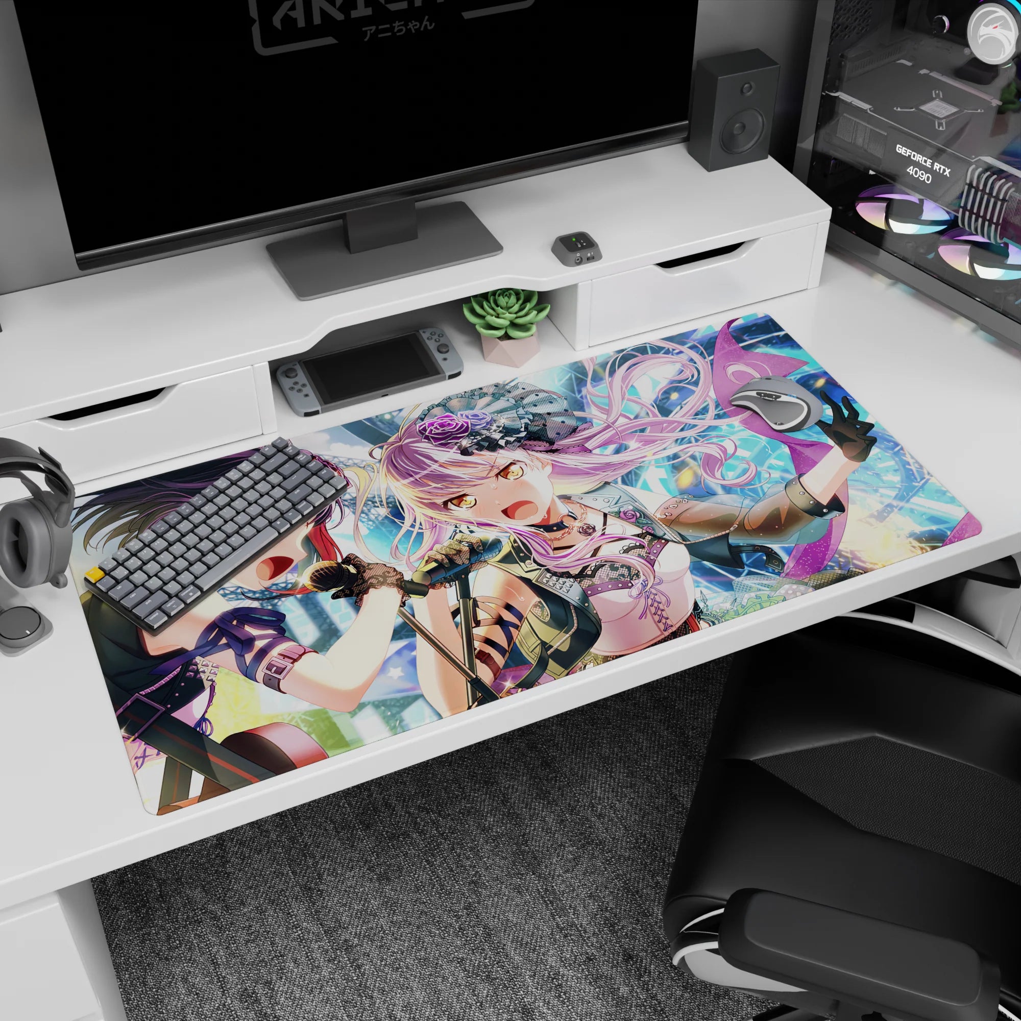 40x20 inches anime idol duo desk pad, lavender-haired singer in mini hat and violet-haired partner mid-song.