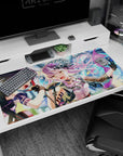 40x20 inches anime idol duo desk pad, lavender-haired singer in mini hat and violet-haired partner mid-song.