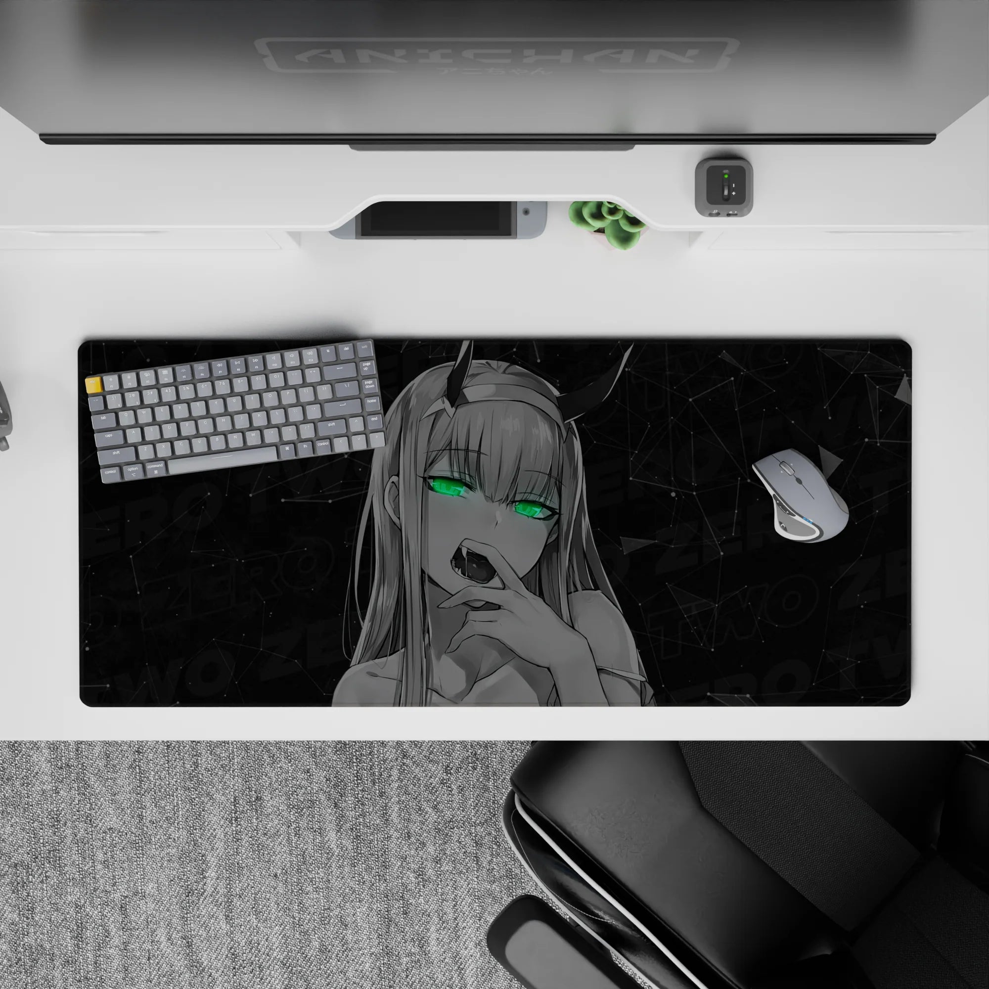 Striking 36x16 desk pad highlights Zero Two's neon green eyes and smirk with a dark, mysterious vibe