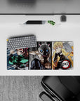 Anime mouse pad 28x12 inches featuring Tanjiro, Inosuke, and Zenitsu from Demon Slayer in dynamic sketch-style action.
