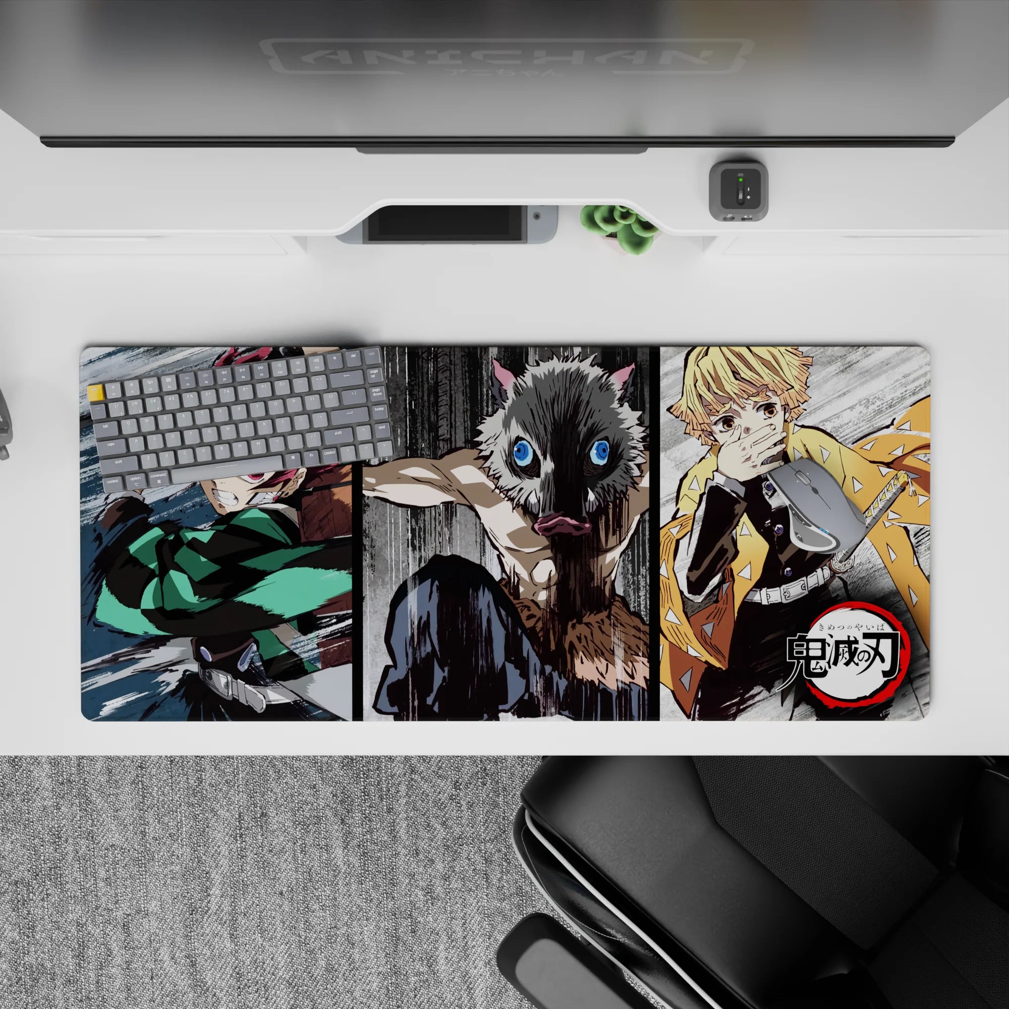 Anime desk pad 36x16 inches featuring Tanjiro, Inosuke, and Zenitsu in a dynamic sketch-style scene from Demon Slayer.