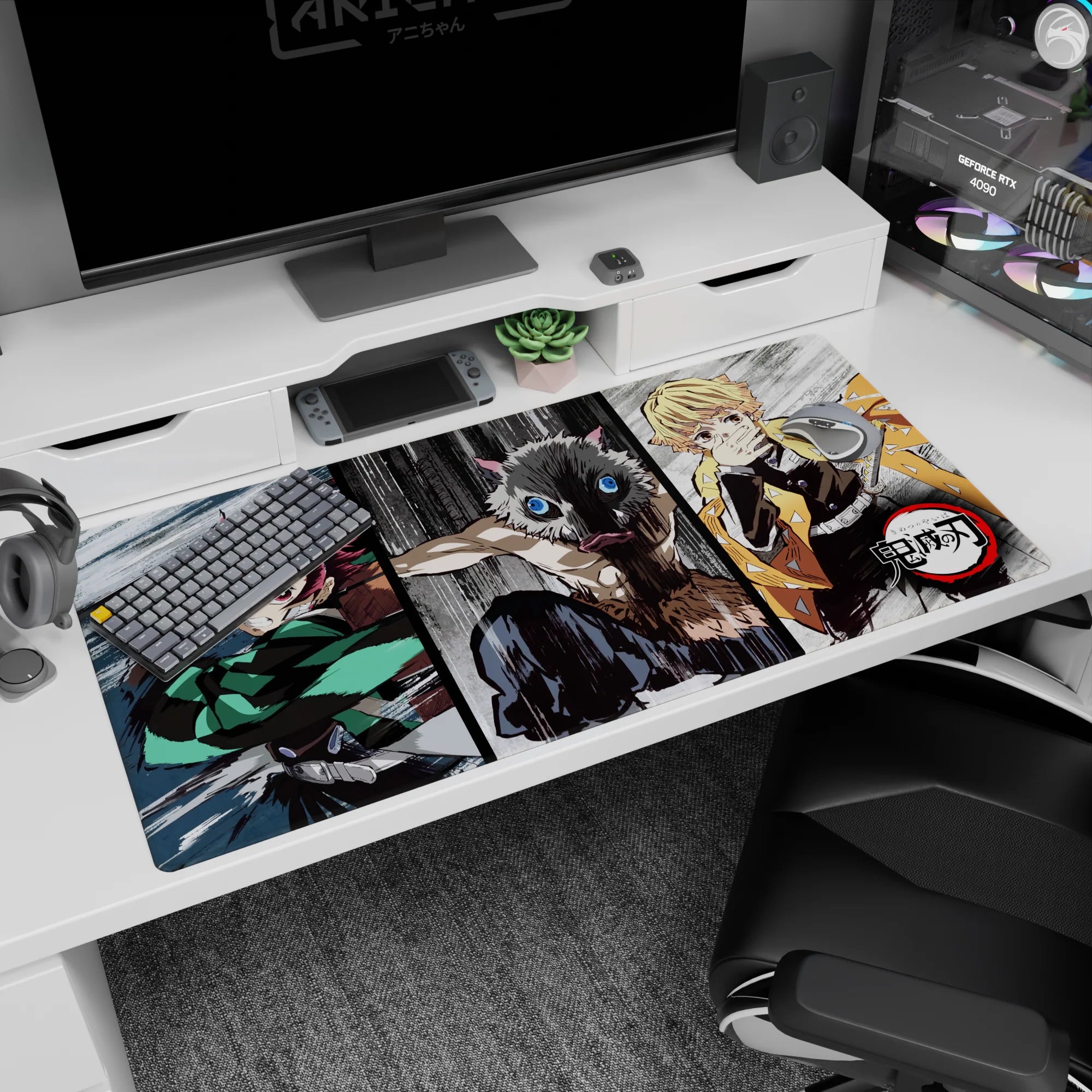 Anime desk pad 40x20 inches featuring Tanjiro, Inosuke, and Zenitsu from Demon Slayer in dynamic sketch-style brawl.