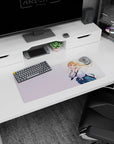 28x12 inches anime girl mouse pad showing finger-to-lips pose, windblown blonde hair, plaid skirt, rolled sleeves.