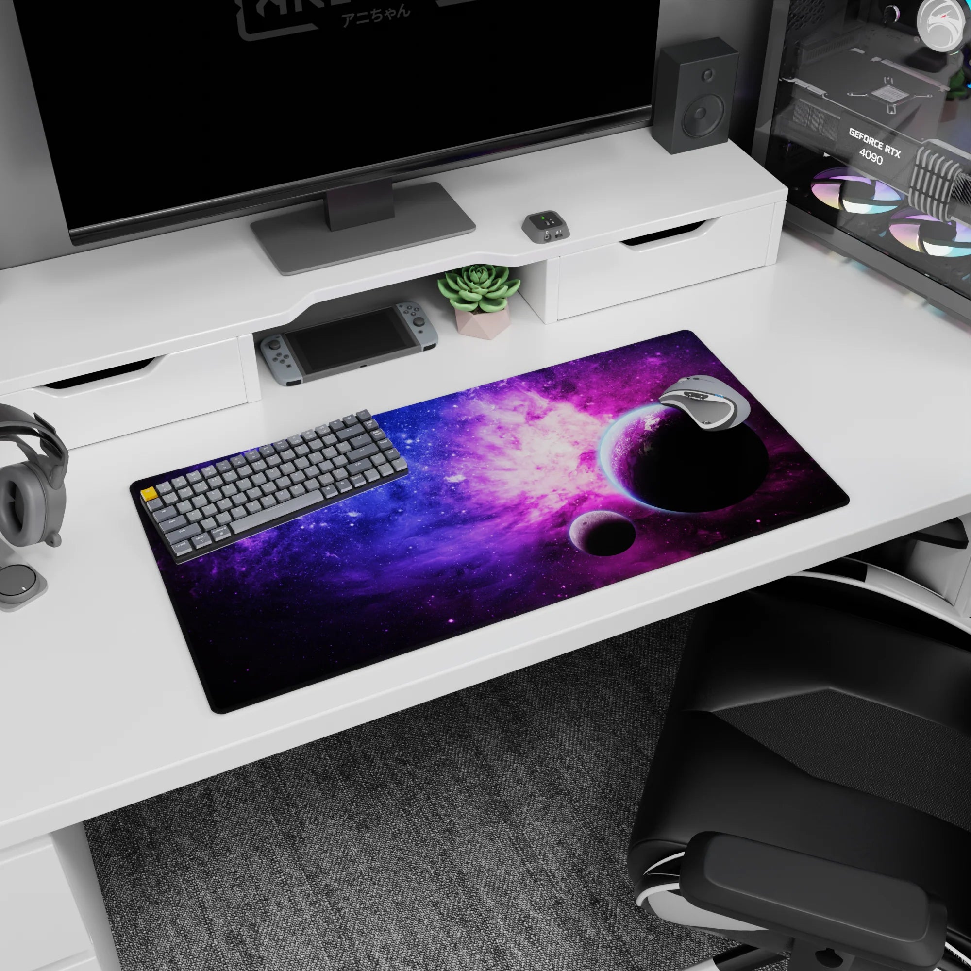 Two floating planets in a starry nebula scene mouse pad 32x16 inches with soft pink cloud accents.