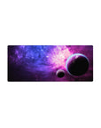Galaxy desk mouse pad 28x12 inches with star-speckled space gradient and two floating planets.