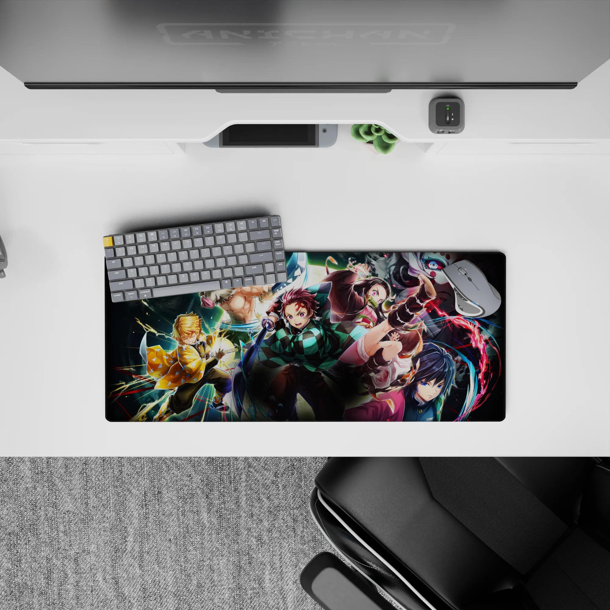 Demon Slayer mouse pad 28x12 inches featuring Tanjiro, Nezuko, Zenitsu, Inosuke, and Giyu in vibrant battle scene.