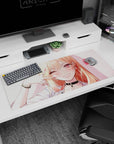 Flirty blonde anime girl desk pad 36x16 inches winks with peace sign, long glossy hair, sparkling piercings.