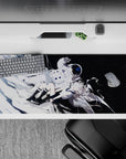 36x16 inches anime desk pad in icy white and deep black, calm cosmic vibe with aqua-eyed angel girl.