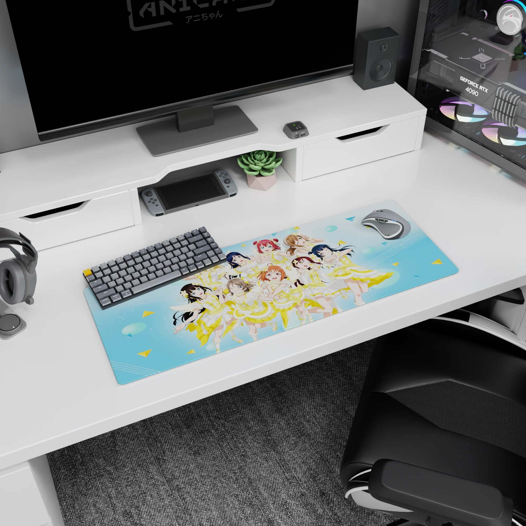 32x12 inches anime mouse pad with nine bubbly idols cheering, winking, and flashing peace signs onstage.