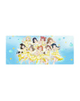 Anime girl mouse pad 28x12 inches with nine idol girls in white-and-lemon stage dresses on blue confetti.