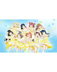 Anime girl desk pad 40x20 inches with nine idol characters in white-lemon stage dresses on blue confetti.