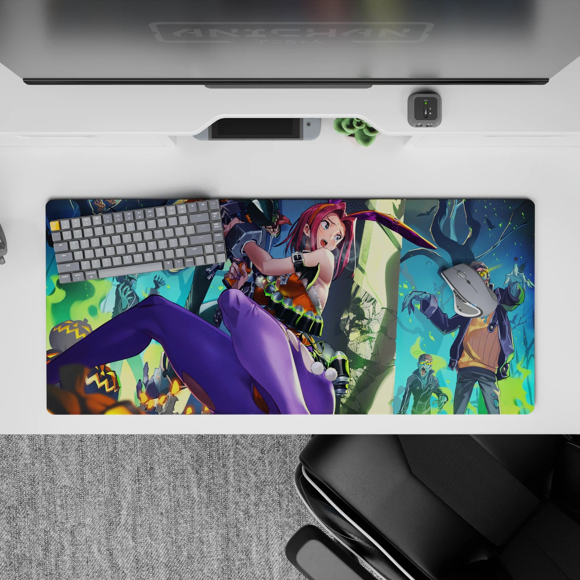 Neon Halloween vibe desk pad 36x16 inches in pink, purple, orange, and teal with eerie smoke and undead.