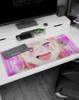 Peach-haired anime girl grinning with hands on cheeks on a 36x16 inches extended desk pad.