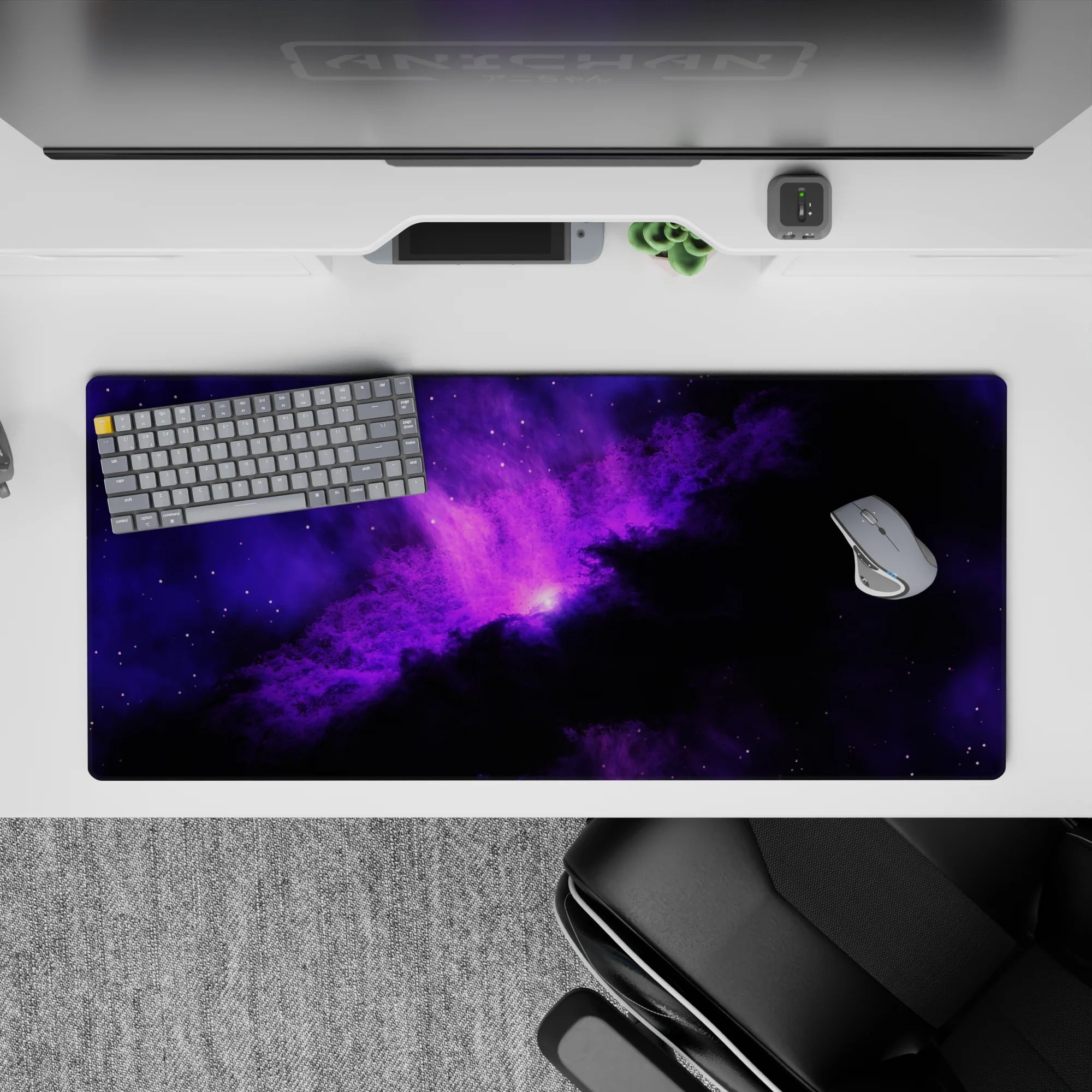 Cozy dreamy purple glow on inky black desk pad for gaming or work, 36x16 inches.
