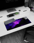 Star-speckled deep-space scene with a central purple nebula on a 28x12 inches extended mouse pad.