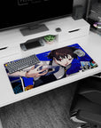 Makoto Niijima on a 32x16 inch Persona 5 anime mouse pad, electric blue backdrop, Queen with knuckle duster, tarot cards.
