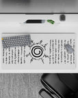 Anime mouse pad featuring the Uzumaki clan symbol from Naruto, 32x16 inches, with black ink on white background.