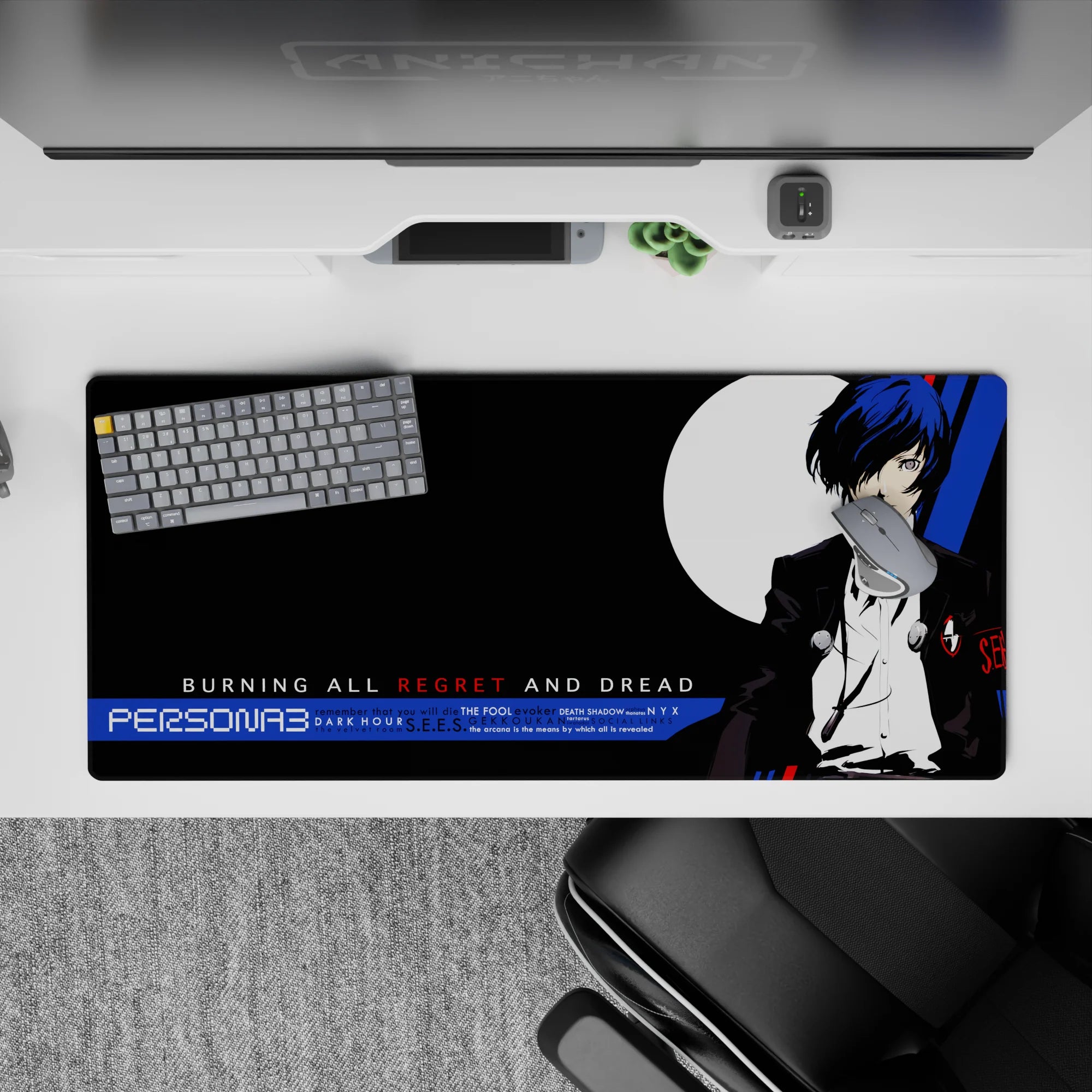 Persona 3 desk pad featuring protagonist in sharp black suit, blue hair, and moon backdrop, 36x16 inches.