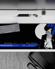 Persona 3 desk pad featuring protagonist in sharp black suit, blue hair, and moon backdrop, 36x16 inches.