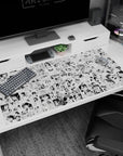 School-uniform anime girls in a busy comic panel pattern desk pad 40x20 inches with bold eyes.