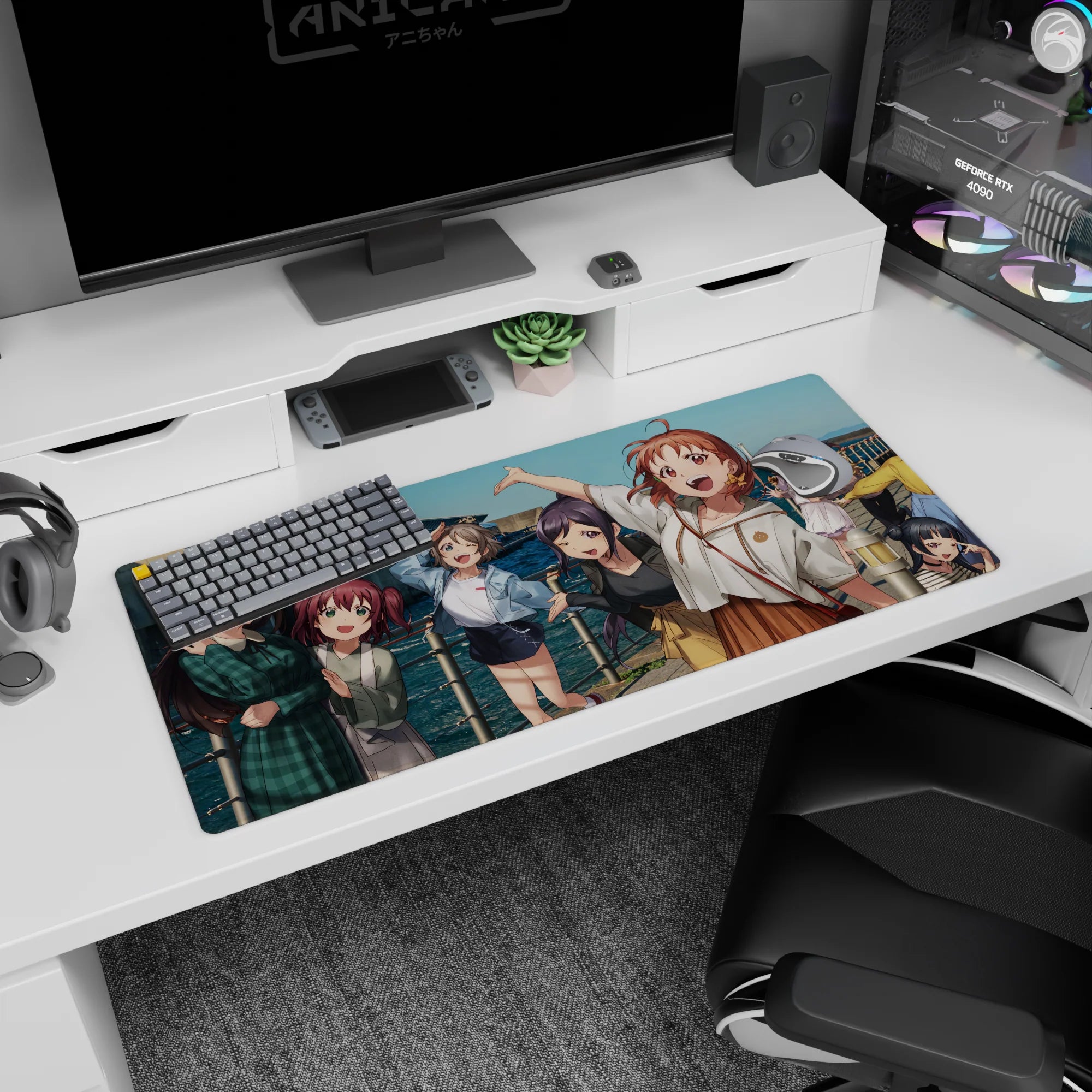 Anime girl desk pad 36x16 inches showing a girl raising her arm, friends crowding a sunny seaside railing.