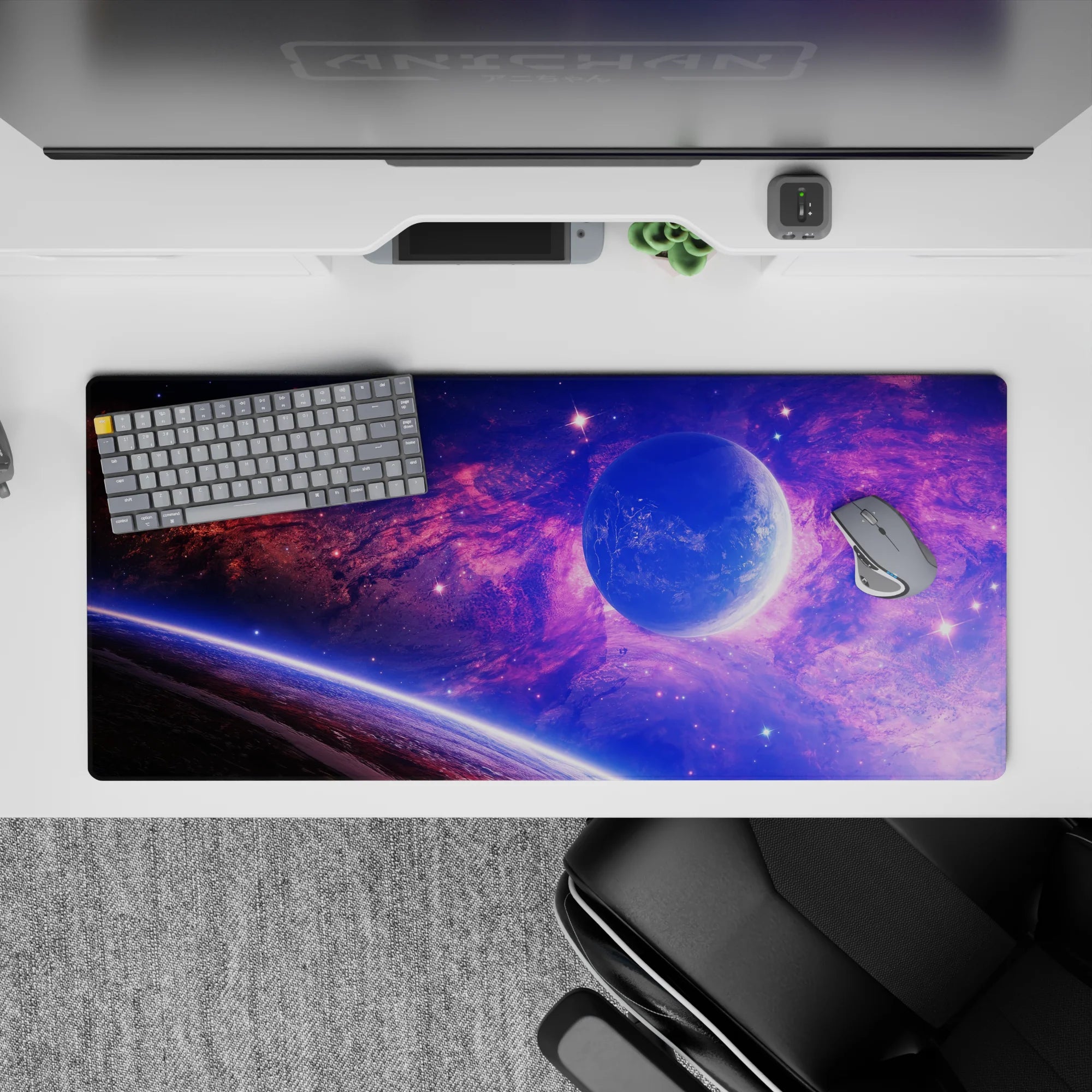 Galaxy-themed desk pad 36x16 inches with violet and blue clouds, glowing planet, and starry space design.