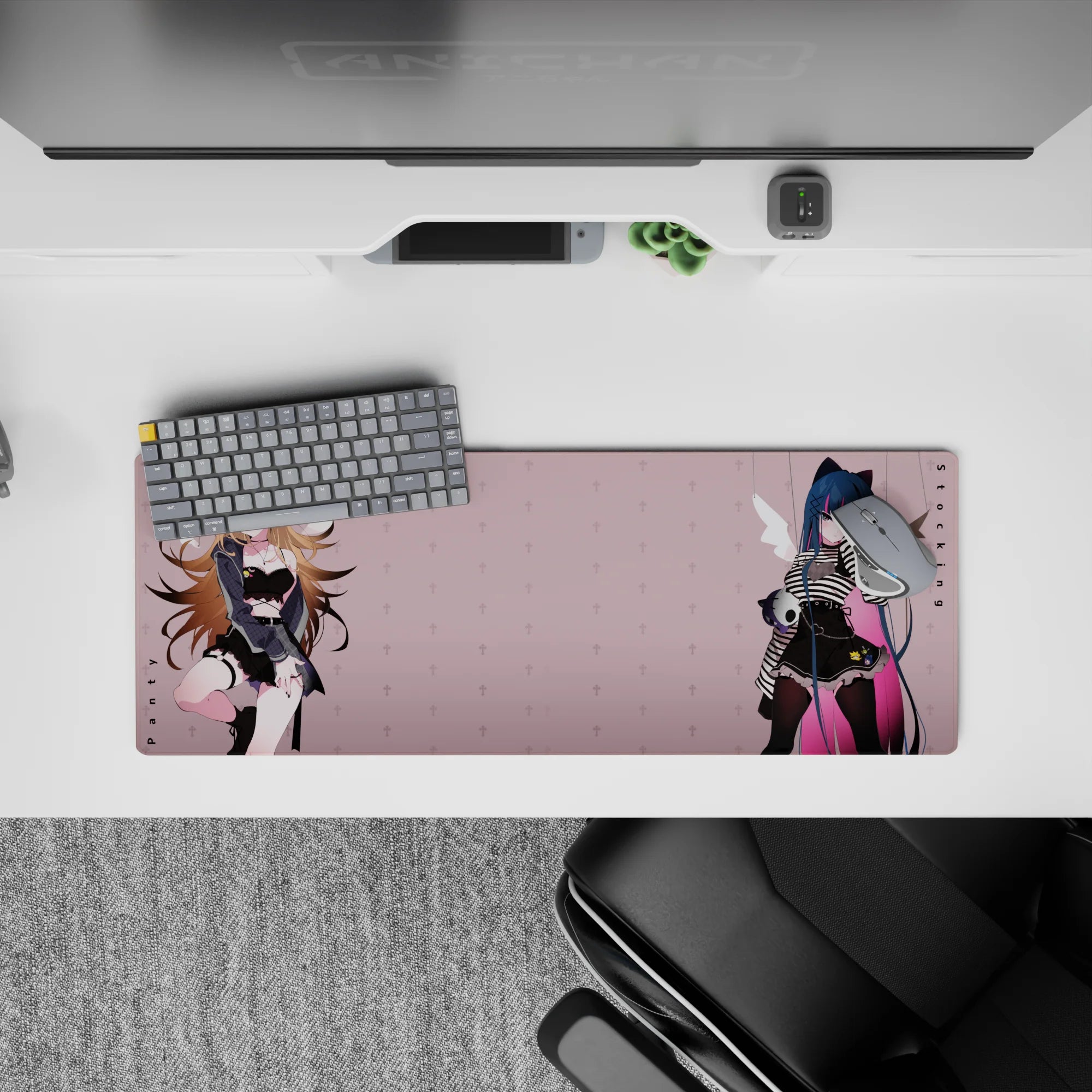 32x12 inches pastel blush desk mat in moody tones, midnight blue hair, pink streak, sharp outfit detail.
