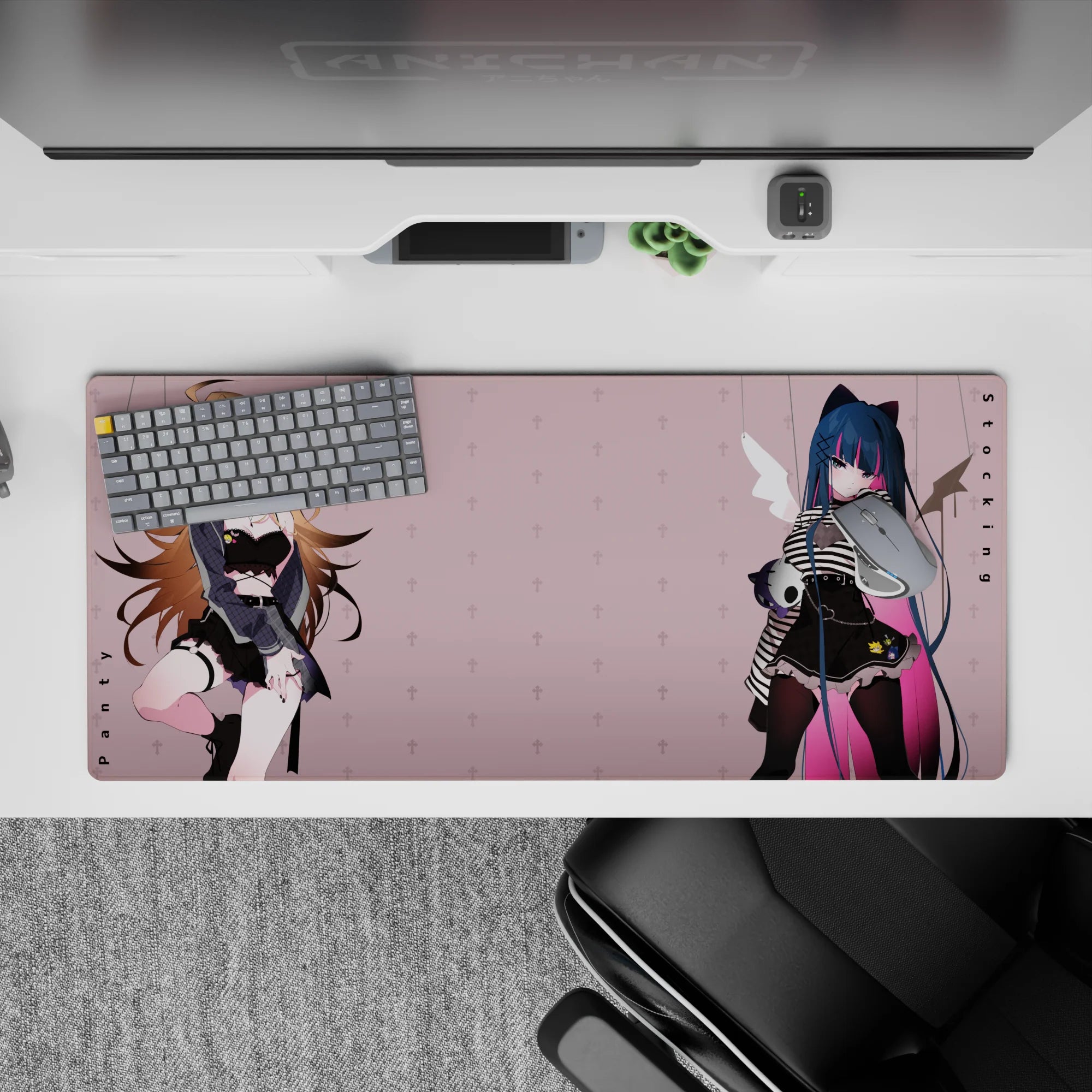Moody pastel anime desk pad 36x16 inches in blush pink with midnight blue hair, pink streak, fleur accents.