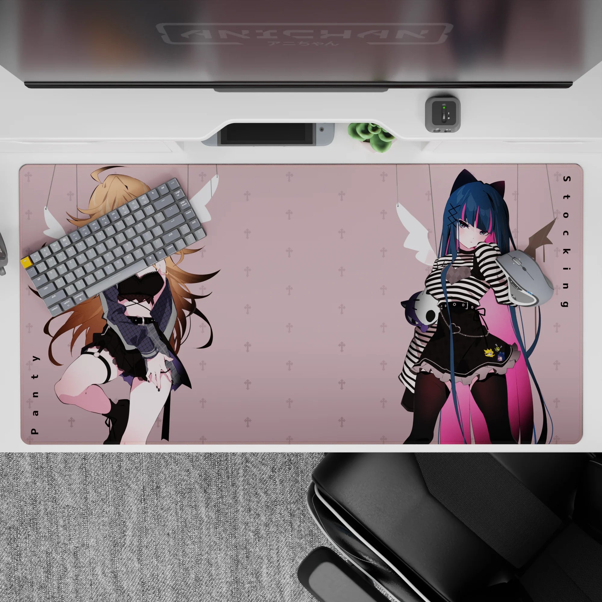 Moody pastel anime desk pad 40x20 inches in blush pink with midnight blue hair, pink streak, and fleur accents.