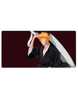 Anime mouse pad 32x16 inches featuring Ichigo Kurosaki's silhouette from Bleach; black robes, orange hair, burgundy backdrop.