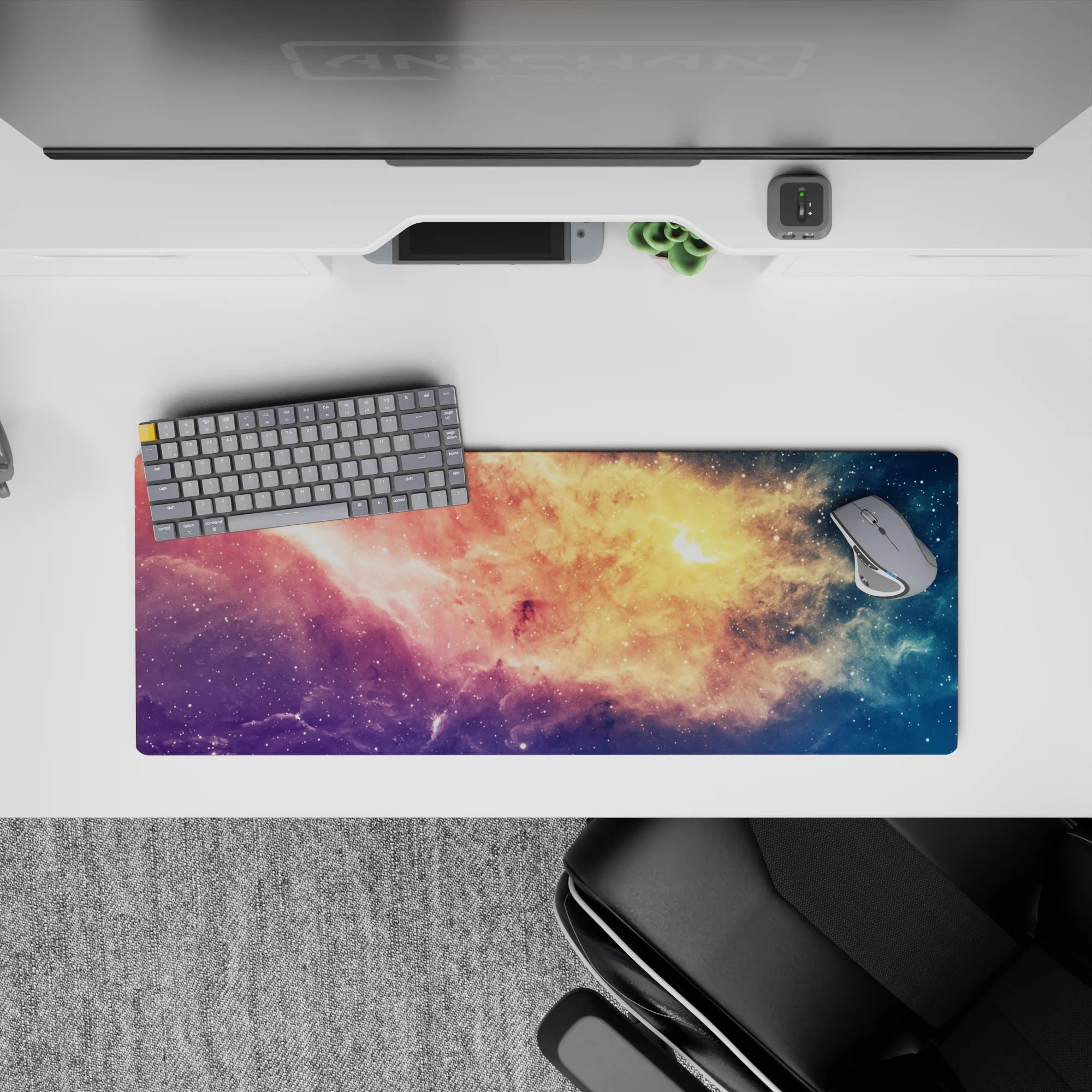 Dreamy pastel galaxy mouse pad 32x12 inches in peach gold, rosy pink, violet, and starry blue.