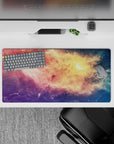 Dreamy candy-sky mouse pad 32x16 inches in peach gold, rosy pink, violet, and deep blue.