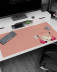 Sleepy anime girl with candy-fade hair and blush marks on a peach desk pad 40x20 inches.